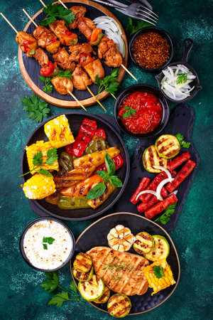 Assortment of grilled bbq meat and vegetablesの写真素材