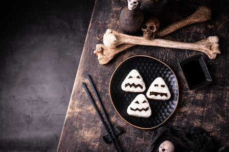 Halloween sushi onigiri in shape of mosterの写真素材