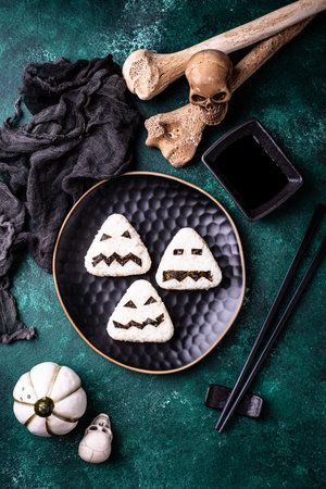Halloween sushi onigiri in shape of mosterの写真素材