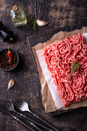 Raw minced meat on dark background