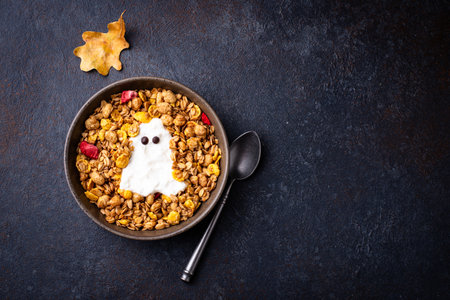 Halloween breakfast. Granola and ghost from yogurtの写真素材