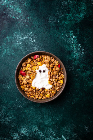 Halloween breakfast. Granola and ghost from yogurtの写真素材