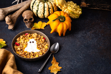 Halloween breakfast. Granola and ghost from yogurtの写真素材