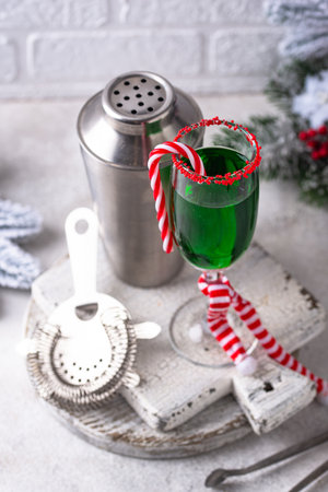 Christmas green cocktail punch with candy caneの写真素材