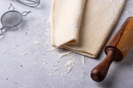 Raw puff pastry dough with baking ingredientの写真素材