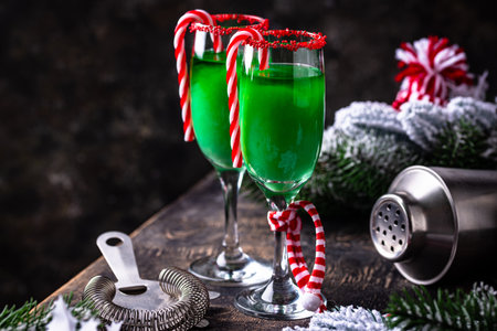 Christmas green cocktail punch with candy caneの写真素材