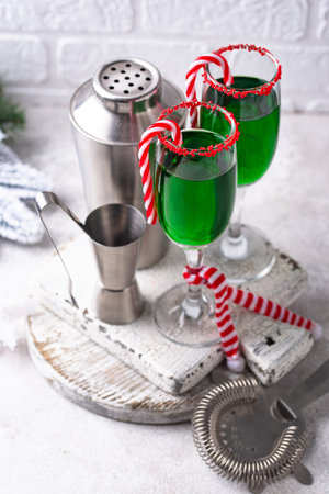 Christmas green cocktail punch with candy caneの写真素材
