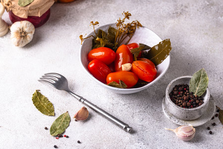 Marinated pickled tomatoes in jarの写真素材