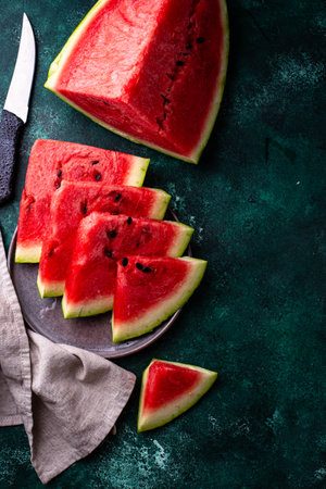 Sliced watermelon on green backgroundの写真素材