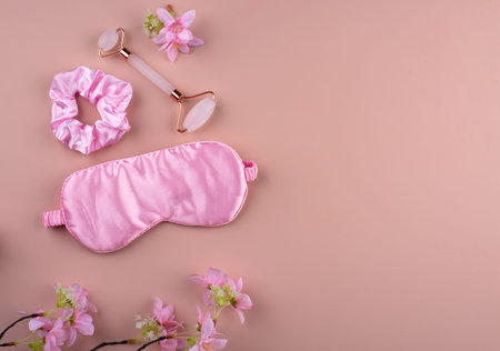 Silk sleep pink eye mask and accessory.の写真素材