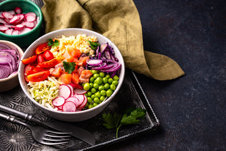 Balanced healthy bowl with vegetables and salmonの写真素材
