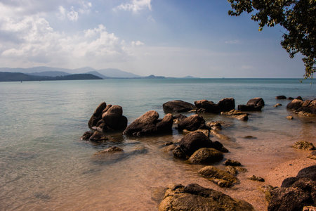 Blue Sky And Beautiful Beach With Enormous Stones