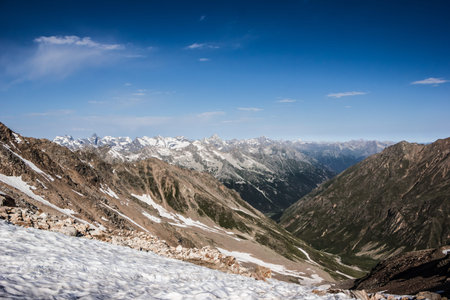 high mountains covered with snow and ice, peaks and valleys in the Caucasus
