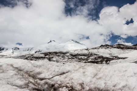 high mountains covered with snow and ice, peaks and valleys in the Caucasus. Peak Elbrusの写真素材