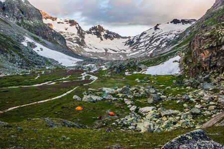 Alpine meadows and rocks in the Caucasus mountains in Russiaの写真素材