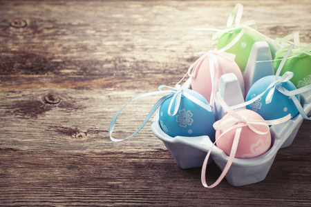 Colorful Easter eggs on wooden backgroundの写真素材