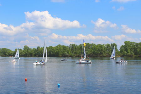 Hetman Cup 2016 Regatta, Dnipro river, Kiev, Ukraine, May 9, 2016. Unidentified yachts are preparing for the regatta on Dnipro gulf of Obolon. Editorial.のeditorial素材