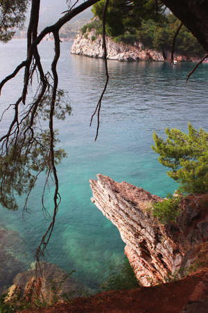 Turquoise clear waters of the Adriatic Sea. Rocky shores. Milocer park. Montenegroの写真素材