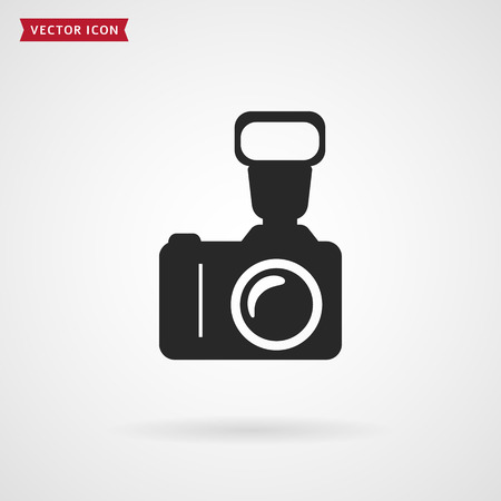Photo camera with flash. Vector icon isolated on white background. Photography theme.のイラスト素材