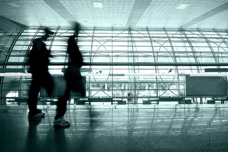 people rushing in airportの写真素材