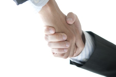 close up zoom shot of asian business handshake isolated in whiteの写真素材
