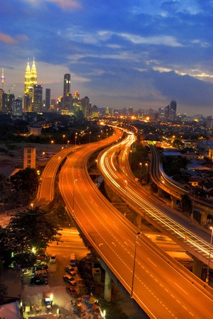 famous landmark of kuala lumpur with fast moving vehicle on highwayの写真素材