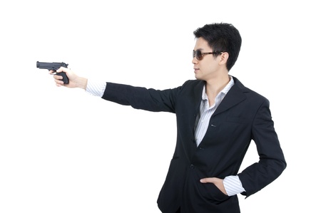 asian business man holding a gunの写真素材