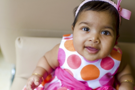 little baby girl resting on the arm of sofa seat, shallow dof, focus on eyes
の写真素材