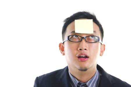 asian man with sticky note, confusedの写真素材