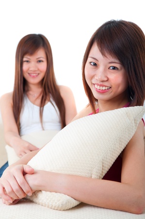 asian girls on sofaの写真素材