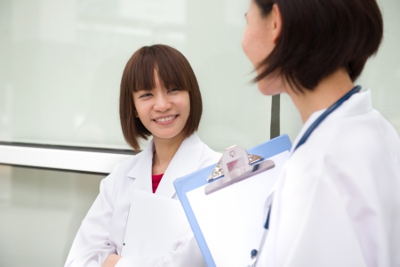 chinese female medical student in a discussionの写真素材