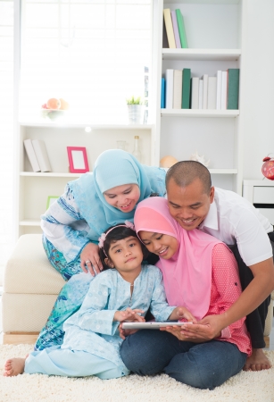 indonesian malay family having a good time surfing internetの写真素材