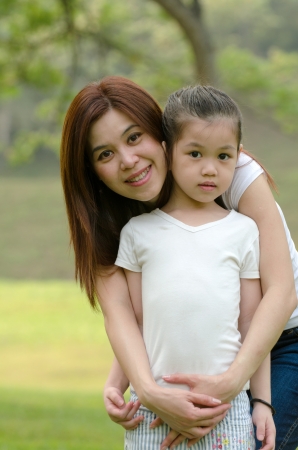 asian chinese mother and  daughter in the parkの写真素材