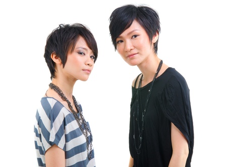 korean sisters girls with isolated white backgroundの写真素材