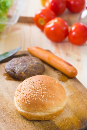 making hamburger fast food ingredients with plenty of raw materials on the backgroundの写真素材
