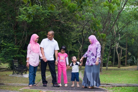 Malay family enjoying quality time outdoor at the parkの写真素材