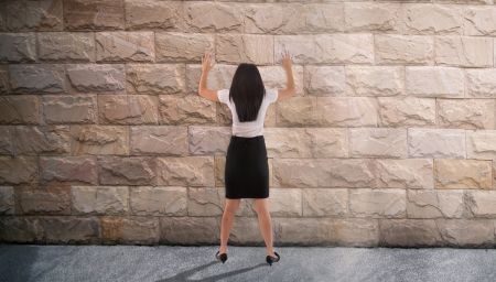 dead end concept photo, asian business woman banging her head against the wallの写真素材