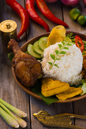 nasi ayam penyet, indonesian fried chicken riceの写真素材