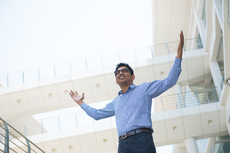  Indian businessman celebrating success at officeの写真素材
