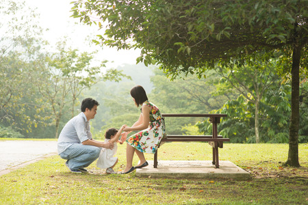 Happy Asian Family enjoying their time in the parkの写真素材