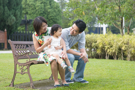 Happy Asian Family enjoying their time in the parkの写真素材