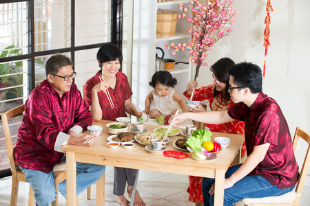 Chinese new year reunion dinner, part of Chinese culture to gather during eveの写真素材