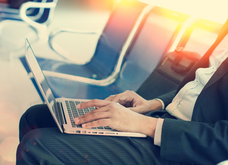 business man with laptop the morning at airport terminalの写真素材