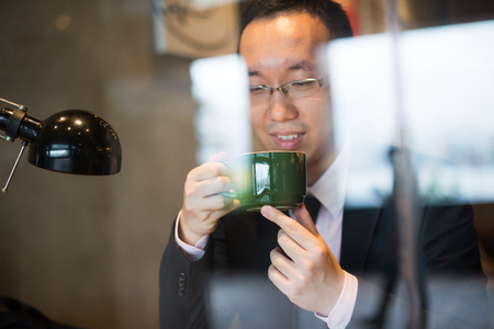 asian business people on coffeeの写真素材