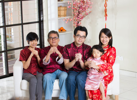 asian family with chinese new year greetings