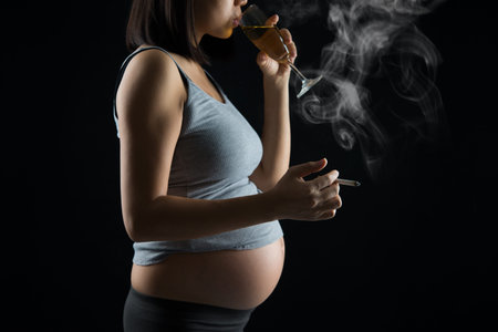 pregnant mother smoking and drinkingの写真素材
