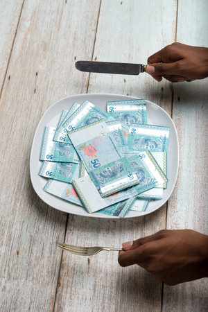 Malaysia Ringgit concept photo on plate