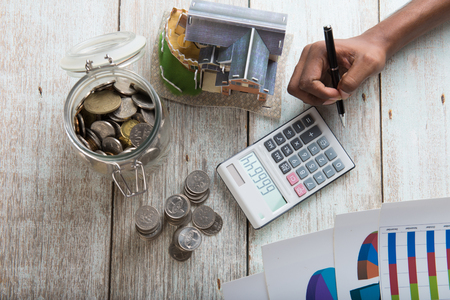 hands calculating home mortgage concept photoの写真素材