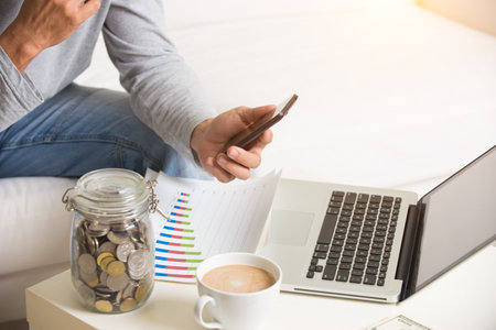 close up of man doing finance at home