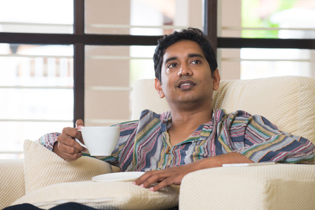 indian male having coffeeの写真素材